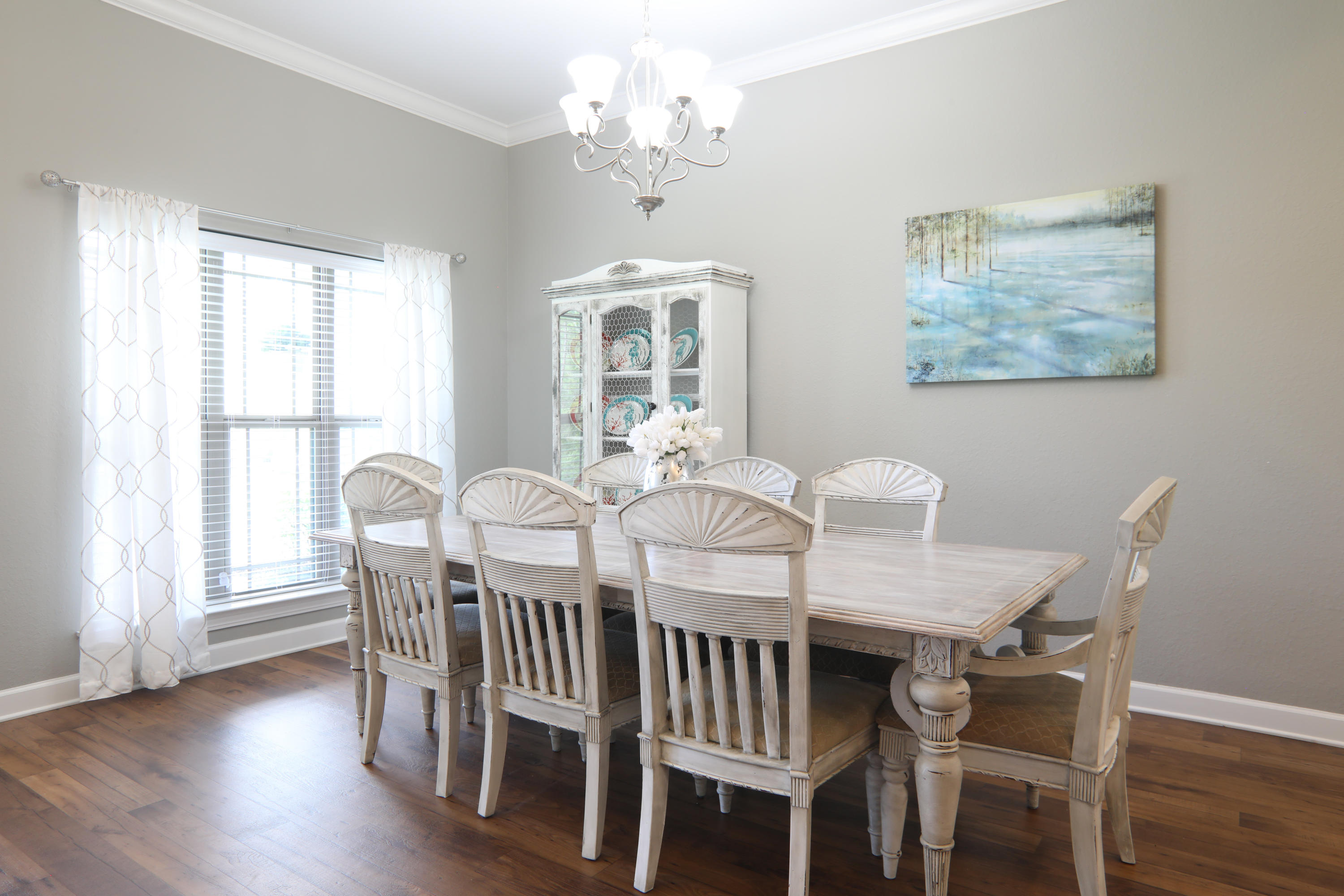 3037 Robinson Point Road Milton, FL 32583 - Photo 4 of 22 a view of a dining room with furniture window and wooden floor
