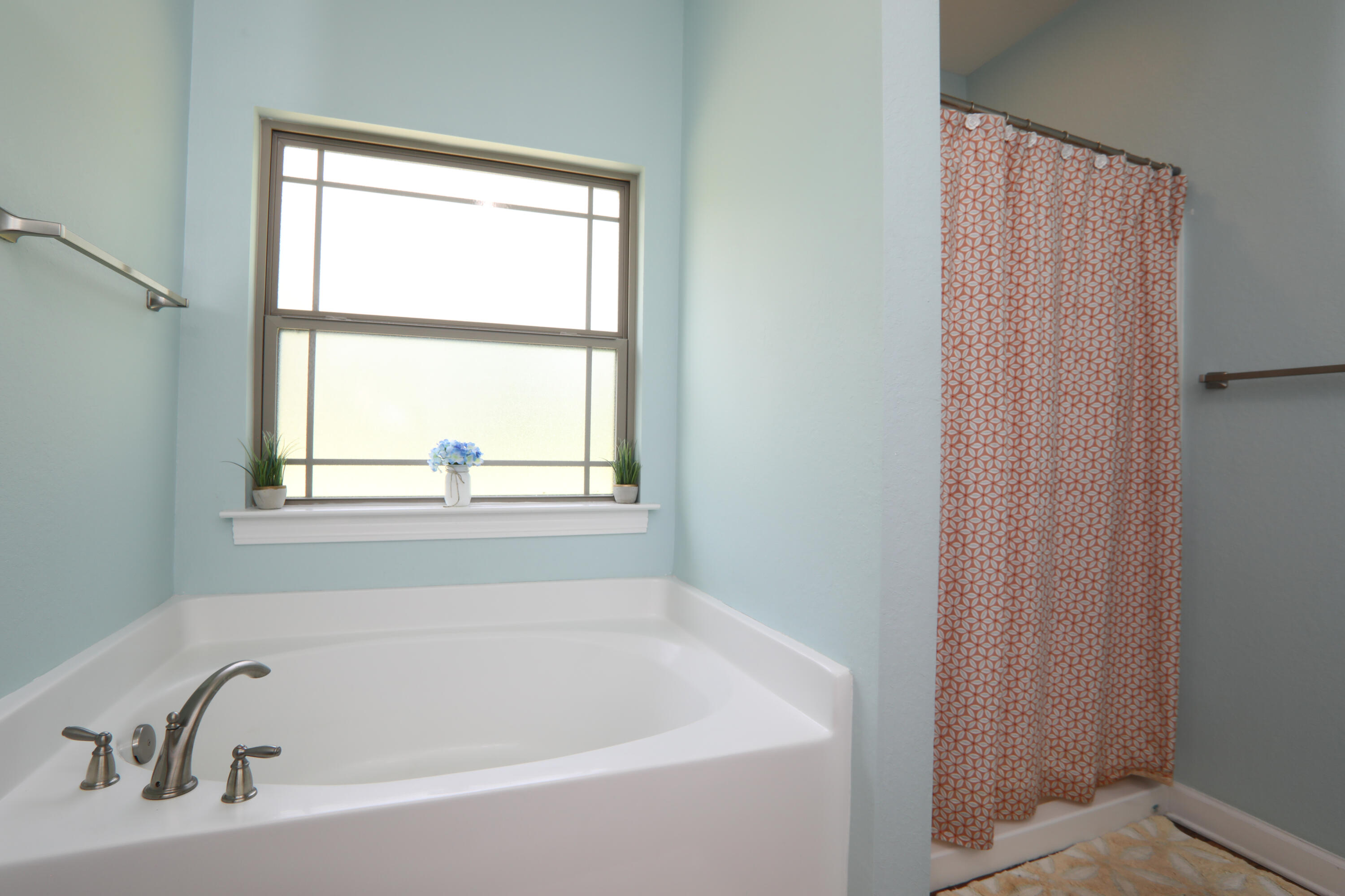 3037 Robinson Point Road Milton, FL 32583 - Photo 10 of 22 a white bath tub sitting next to a window