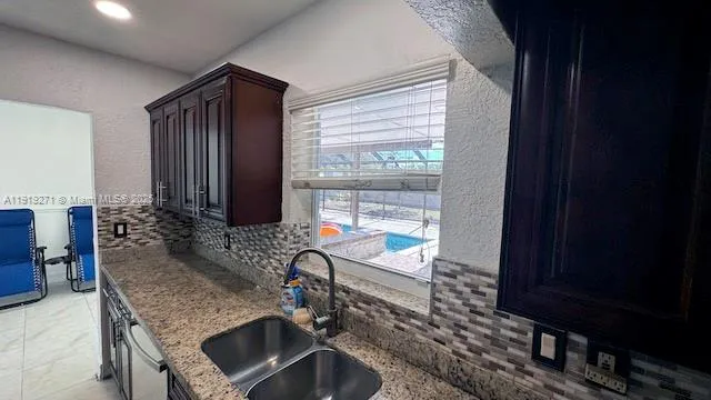 a view of workspace with furniture and a window