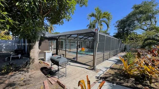 a view of a backyard with sitting area and furniture