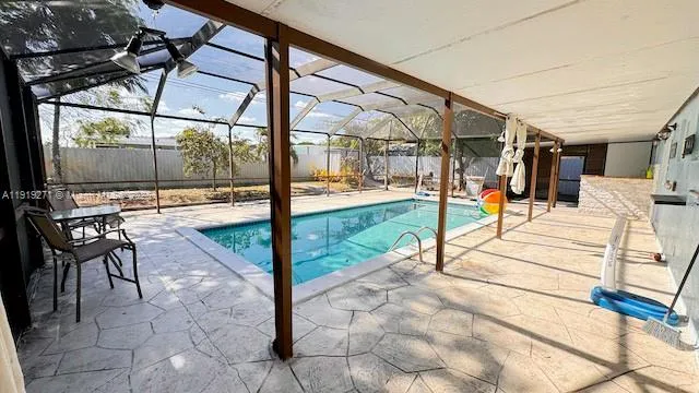 a kitchen view of microwave a stove and cabinets