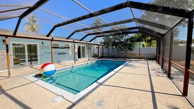 a backyard of a house with chairs