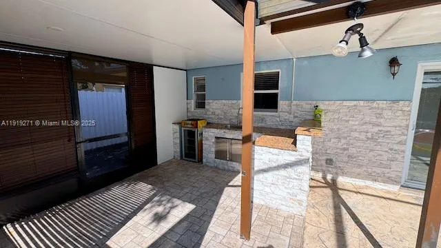a view of a balcony with chairs and a table