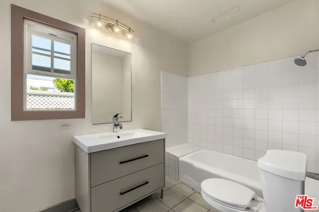 a bathroom with a toilet a sink and bathtub