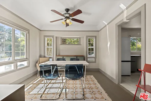 a view of a livingroom with furniture window and wooden floor