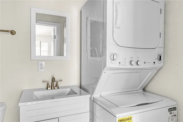 a bathroom with a sink mirror and toilet