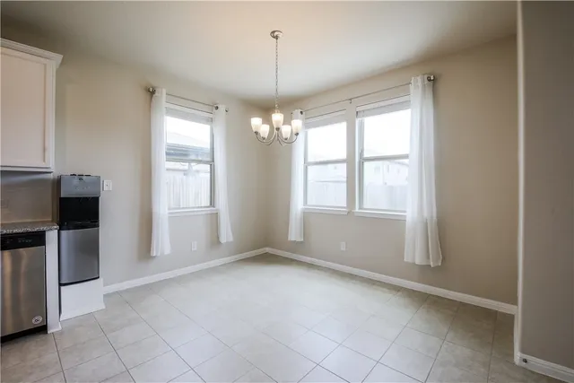 a view of a kitchen with a stove cabinets and a kitchen