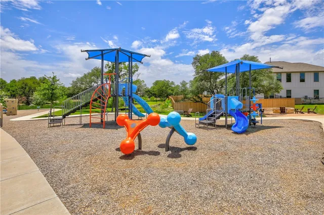 a view of a park with large trees