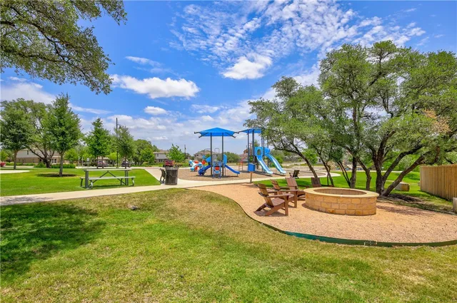 a view of a house with sitting area and a yard