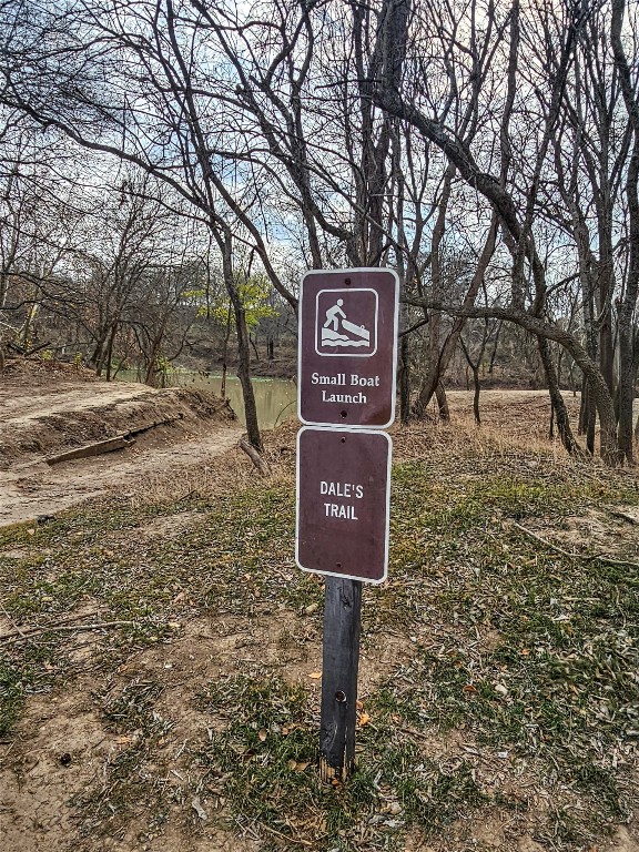 416 Riverside Drive Bastrop, TX 78602 - Photo 7 of 8 a sign on the side of the road