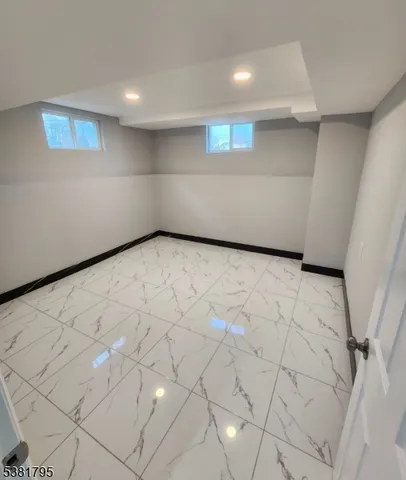 a view of a livingroom with furniture and a ceiling fan