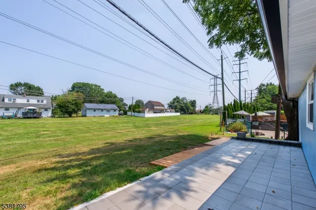a view of a house with a backyard porch and sitting area