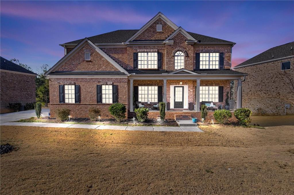 a front view of a house with outdoor seating