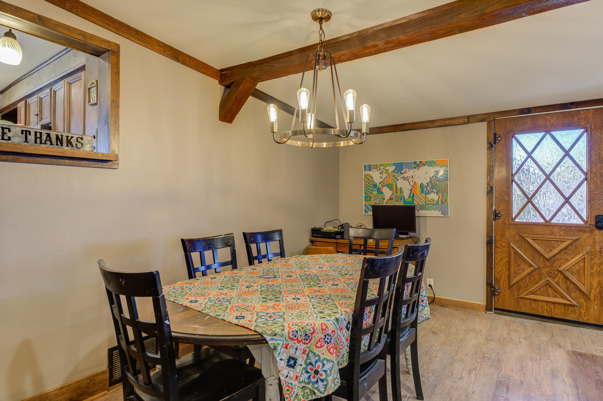 2741 County Road 3 Slaton, TX 79364 - Photo 17 of 51 a view of a dining room with furniture and chandelier