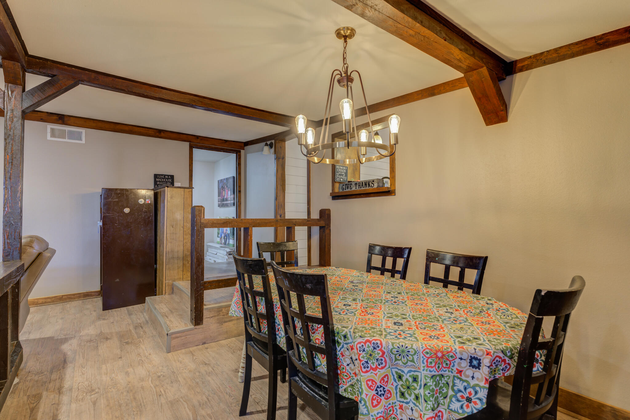 2741 County Road 3 Slaton, TX 79364 - Photo 18 of 51 a view of a dining room with furniture and chandelier