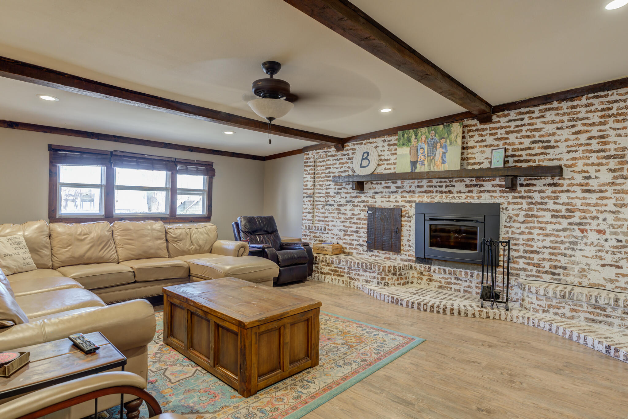 2741 County Road 3 Slaton, TX 79364 - Photo 19 of 51 a living room with furniture and a fireplace