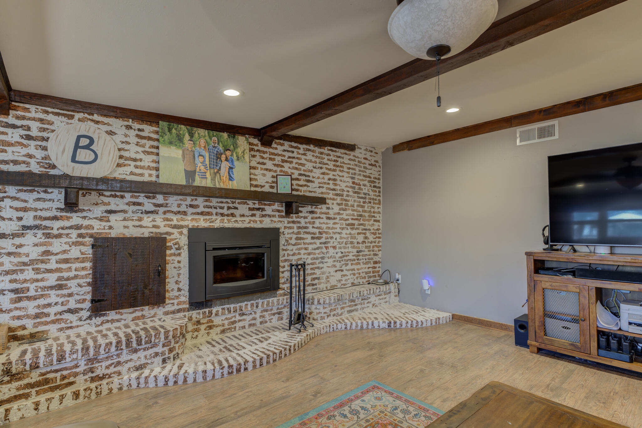 2741 County Road 3 Slaton, TX 79364 - Photo 24 of 51 a living room with furniture and a fireplace
