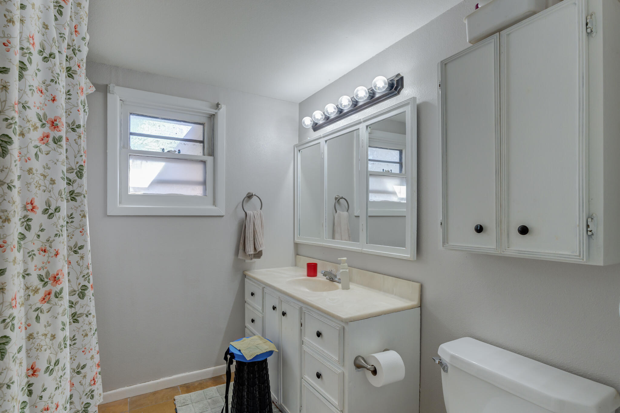 2741 County Road 3 Slaton, TX 79364 - Photo 28 of 51 a bathroom with a sink vanity granite toilet and a mirror