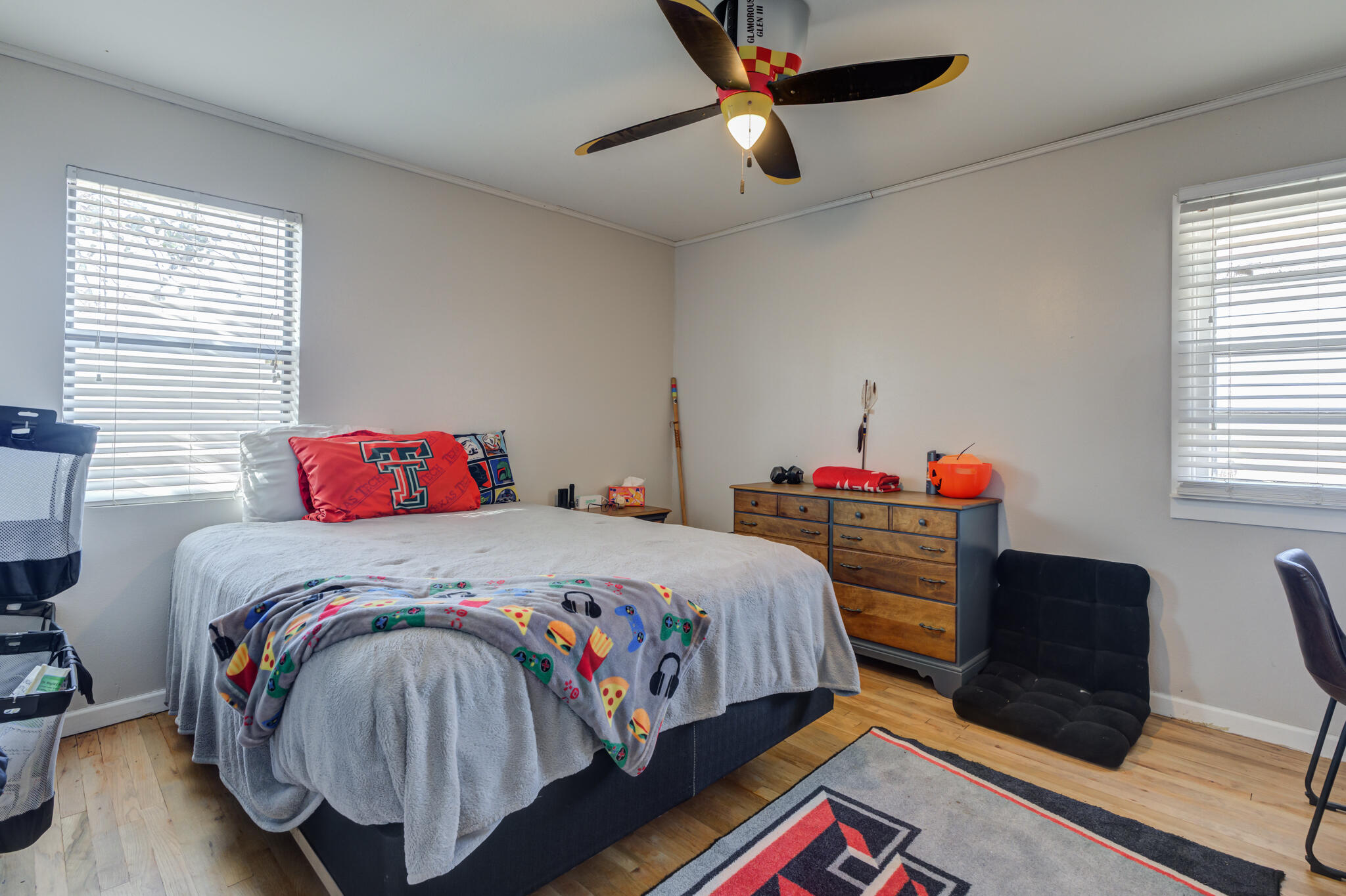 2741 County Road 3 Slaton, TX 79364 - Photo 30 of 51 a bedroom with a bed and a desk