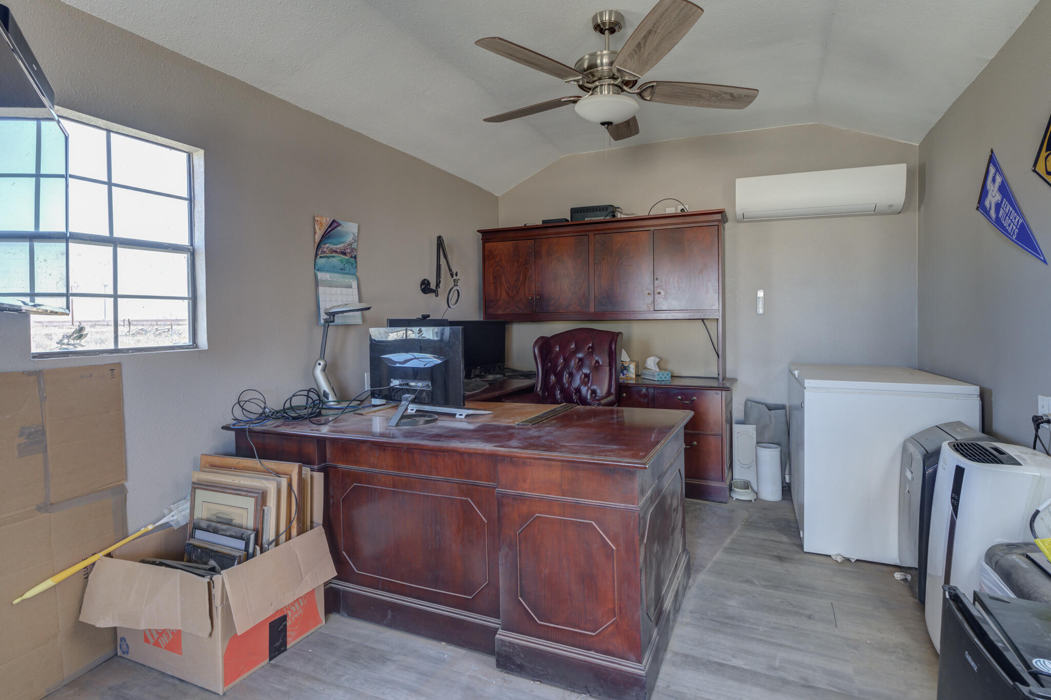 2741 County Road 3 Slaton, TX 79364 - Photo 46 of 51 a room with furniture a rug and a window