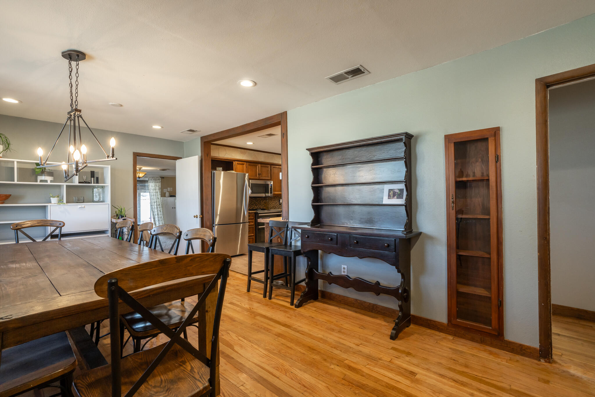 2741 County Road 3 Slaton, TX 79364 - Photo 6 of 51 a view of a dining room with furniture and wooden floor