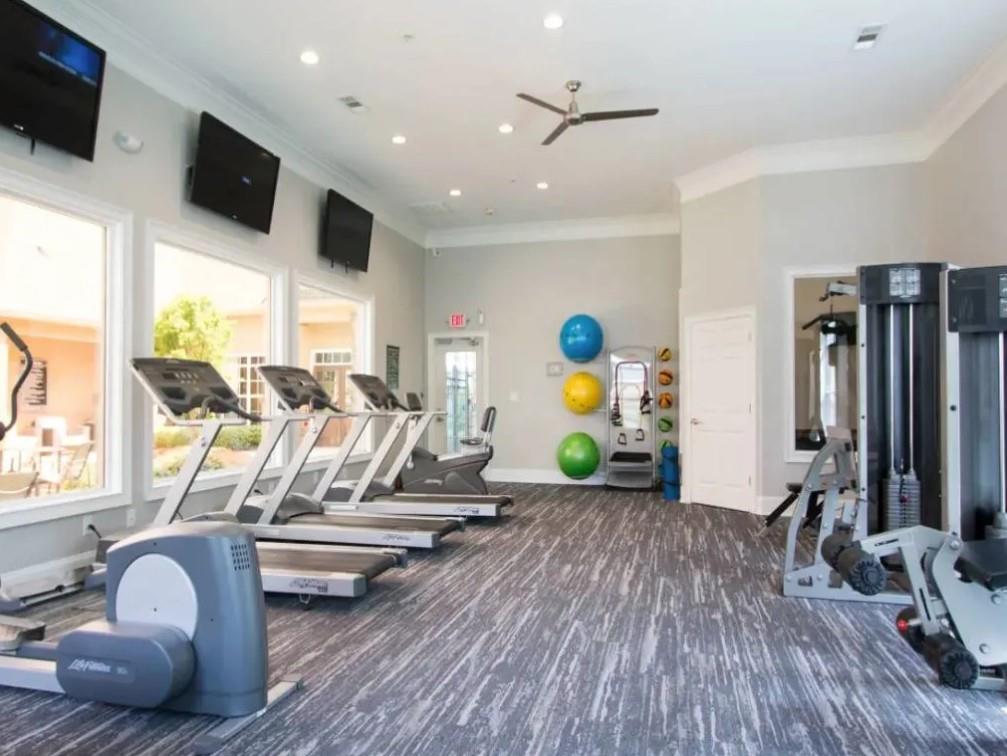 100 Crossing Boulevard, Unit 1518 McDonough, GA 30253 - Photo 16 of 26 a view of a room with gym equipment