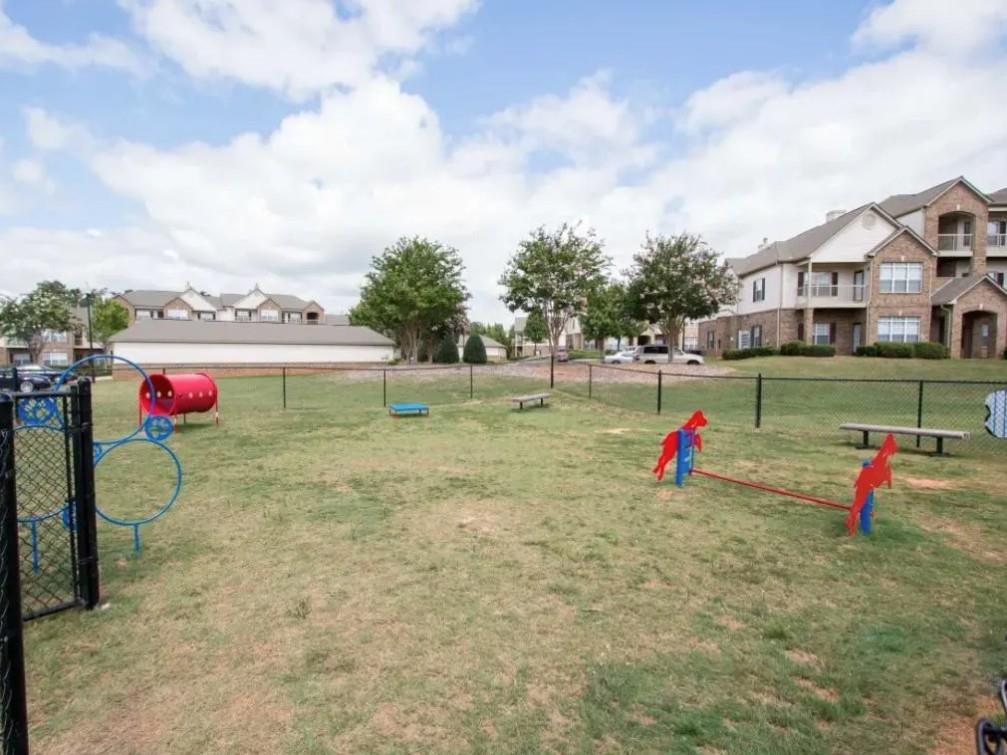 100 Crossing Boulevard, Unit 1518 McDonough, GA 30253 - Photo 20 of 26 an outdoor space with lots of swings and slides