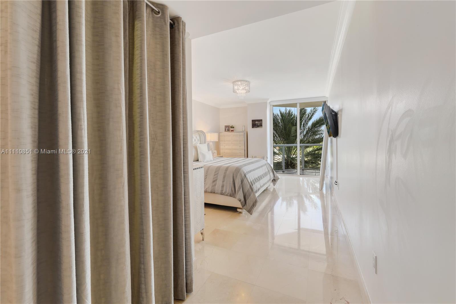 8925 Collins Avenue, Unit 5E Surfside, FL 33154 - Photo 20 of 54 a en suite bathroom with a toilet