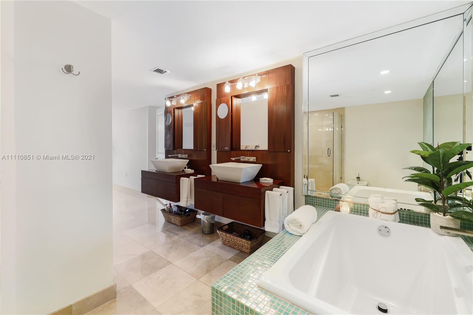 8925 Collins Avenue, Unit 5E Surfside, FL 33154 - Photo 27 of 54 a living room with furniture and large windows