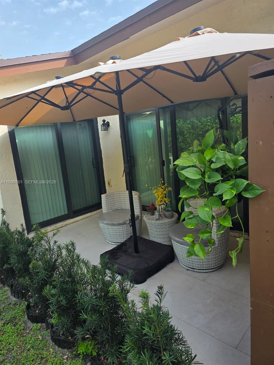 893 Southwest 120th Way Davie, FL 33325 - Photo 21 of 22 a front view of a house with garden