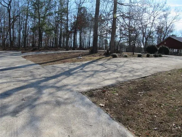a kitchen with kitchen island granite countertop wooden cabinets and a stove