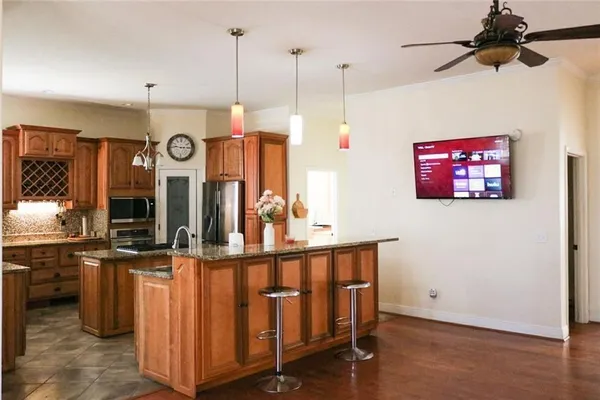a living room with furniture and stairs