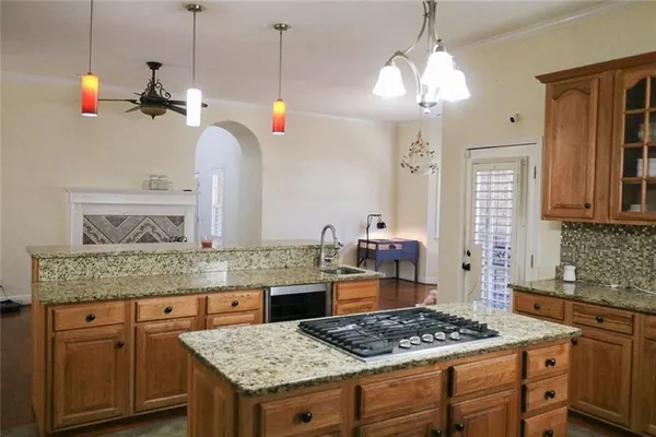 a white toilet sitting next to a shower