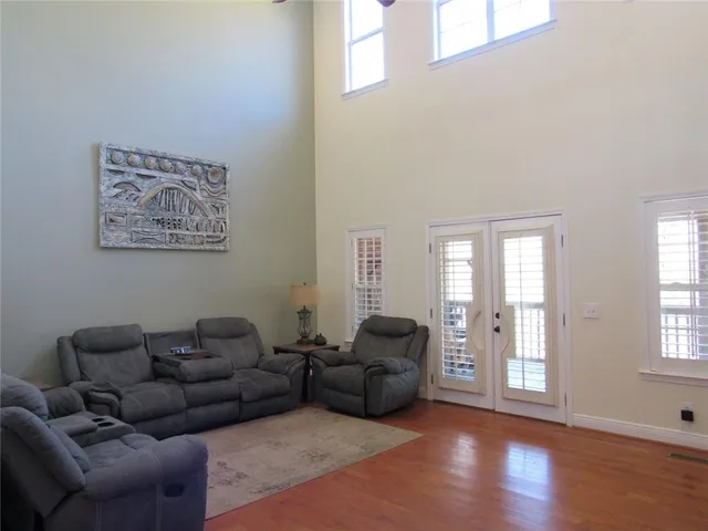 a view of an entryway with wooden floor
