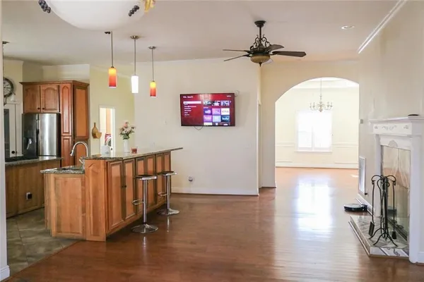 a kitchen with stainless steel appliances granite countertop a sink and a stove