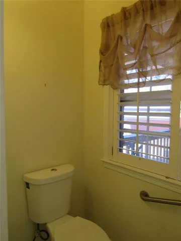 a kitchen with stainless steel appliances granite countertop a sink and a stove