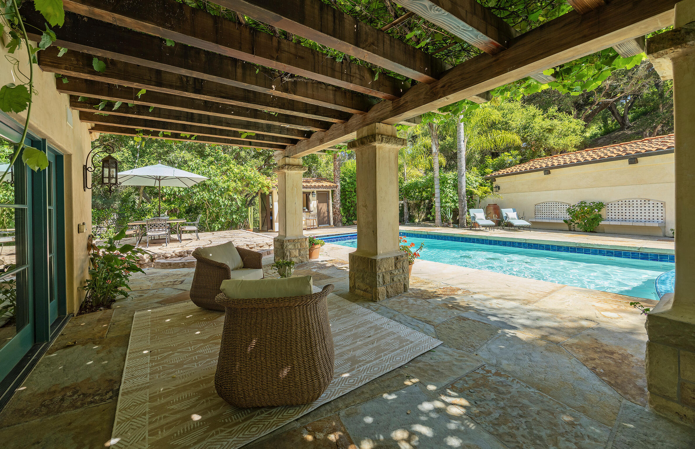 1493 Sycamore Canyon Road Montecito, CA 93108 - Photo 34 of 47 a view of a porch with furniture and a yard