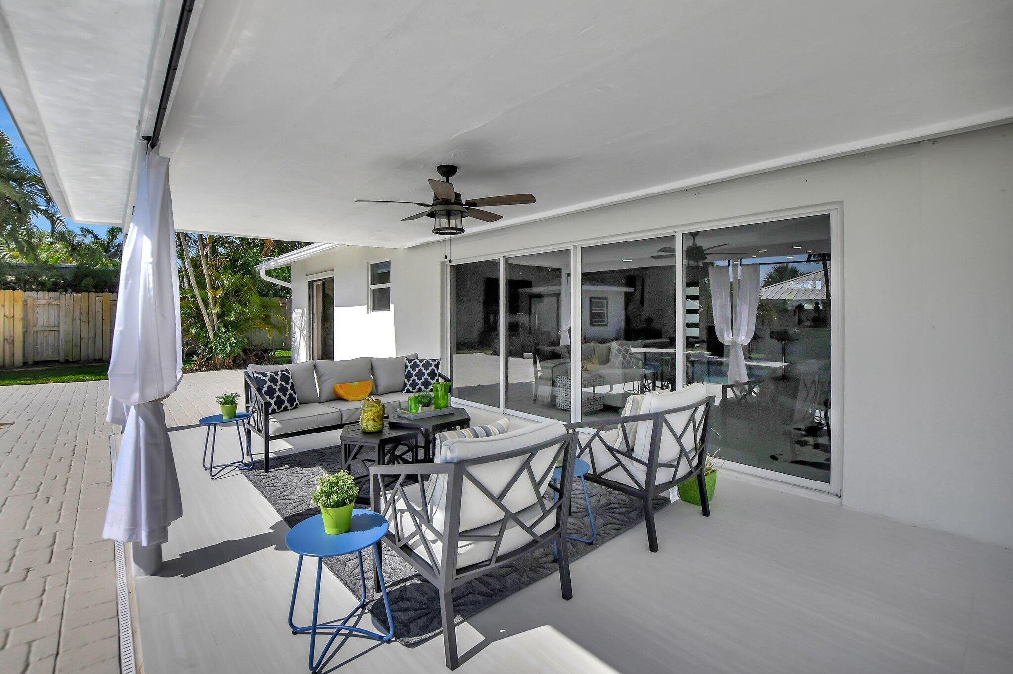 832 Southwest 10th Avenue Boca Raton, FL 33486 - Photo 33 of 57 a building outdoor space with patio furniture and potted plants