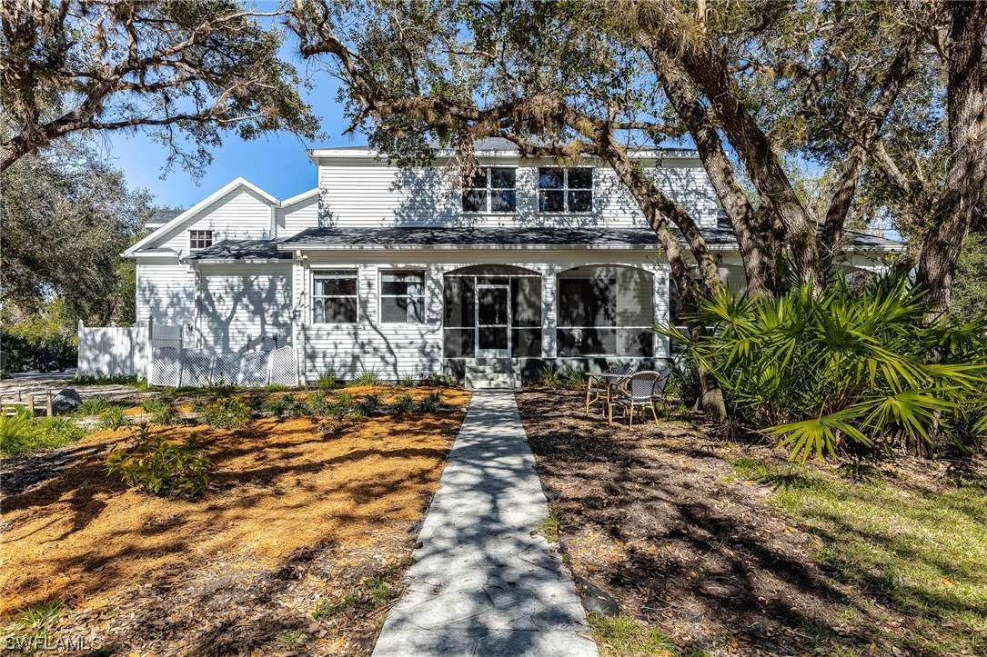17280 Frank Road Alva, FL 33920 - Photo 37 of 49 a front view of a house with a yard