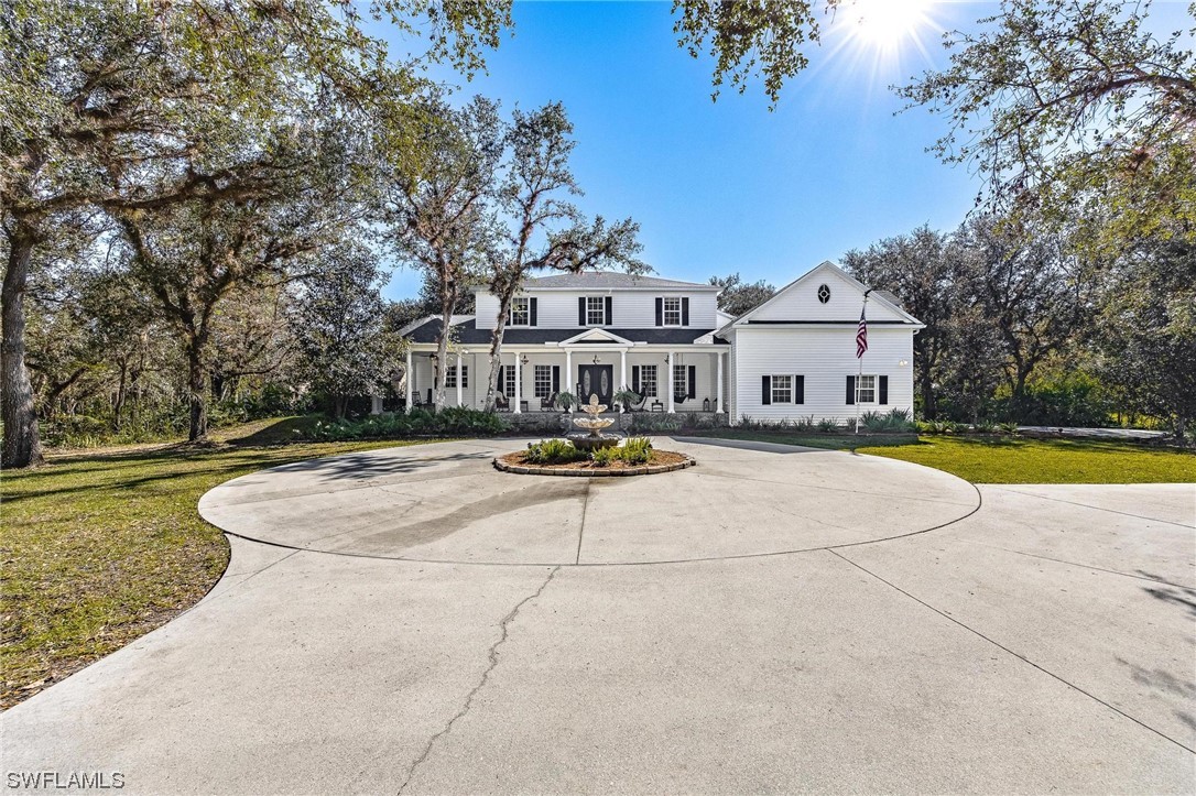 17280 Frank Road Alva, FL 33920 - Photo 4 of 49 a view of swimming pool with outdoor seating and house in the background