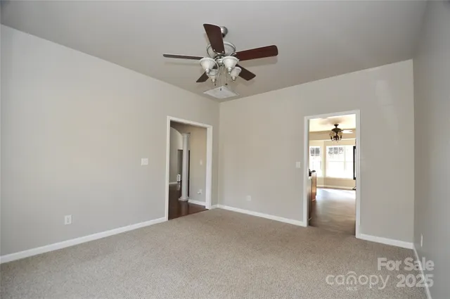 a kitchen with stainless steel appliances granite countertop a sink a stove and a wooden floors