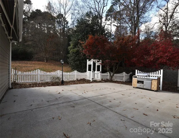 a view of a house with a yard and garage