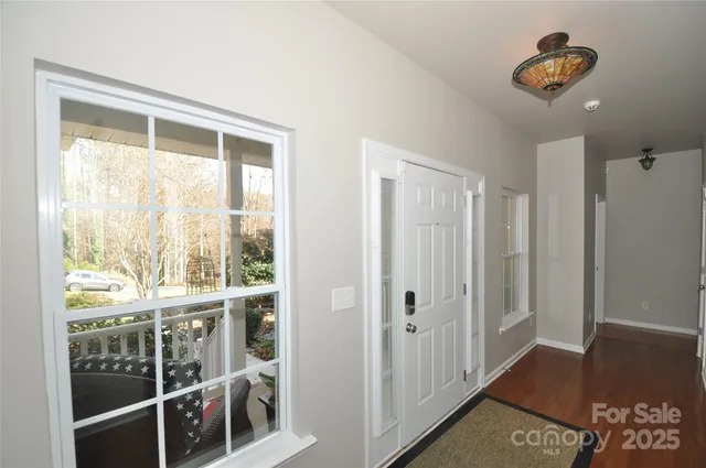 a view of entry way with wooden floor