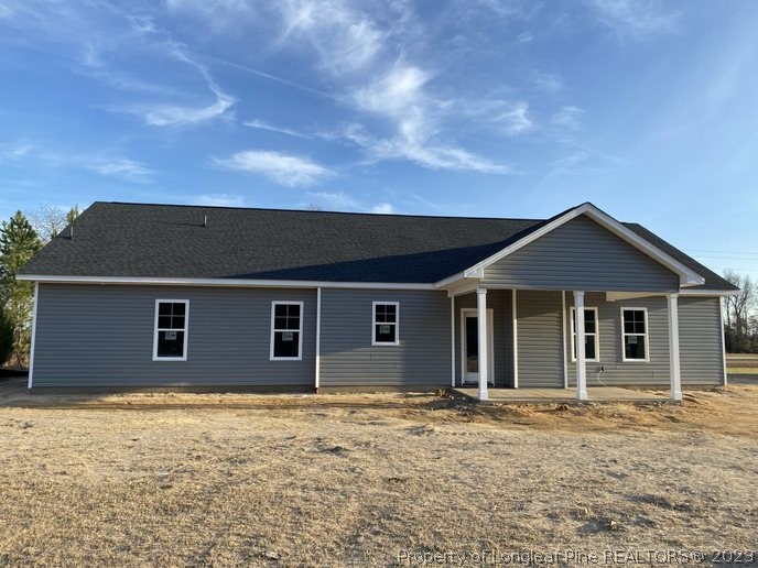 7740 Rufus Johnson Road Fayetteville, NC 28312 - Photo 11 of 11 a front view of a house with yard