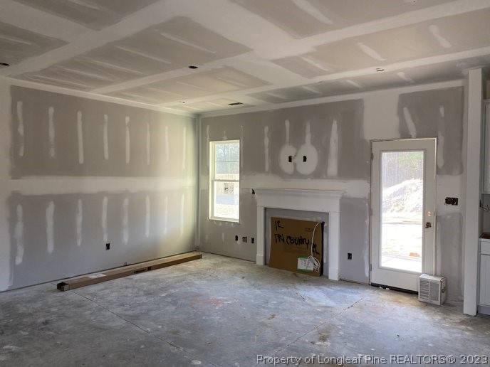 7740 Rufus Johnson Road Fayetteville, NC 28312 - Photo 3 of 11 a view of empty room with a fireplace