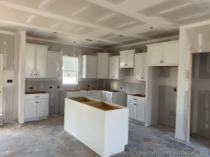 7740 Rufus Johnson Road Fayetteville, NC 28312 - Photo 4 of 11 a kitchen with cabinets appliances a sink and a counter top space