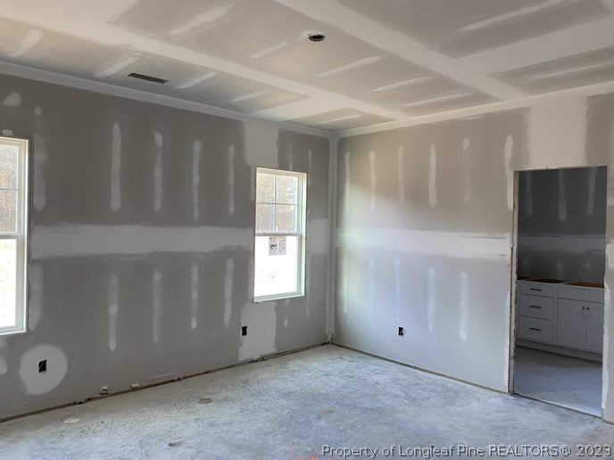 7740 Rufus Johnson Road Fayetteville, NC 28312 - Photo 5 of 11 a view of an empty room with a window