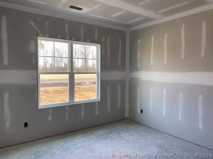 7740 Rufus Johnson Road Fayetteville, NC 28312 - Photo 7 of 11 a view of an empty room with a window