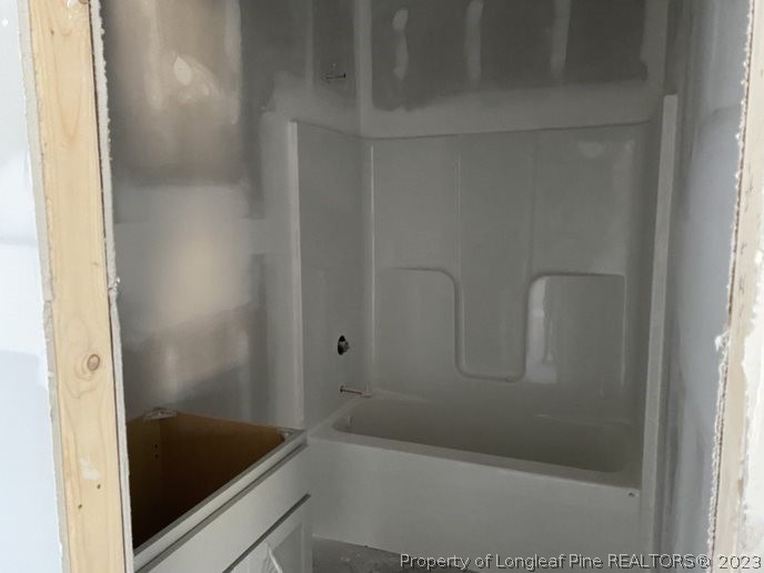 7740 Rufus Johnson Road Fayetteville, NC 28312 - Photo 9 of 11 a bathroom with a bathtub