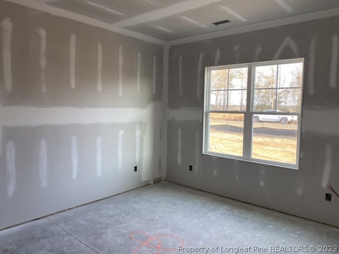 7740 Rufus Johnson Road Fayetteville, NC 28312 - Photo 10 of 11 an empty room with windows